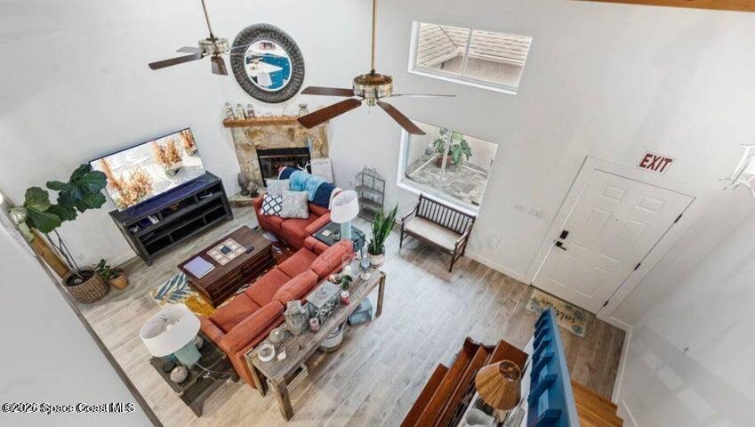 108 Washington Avenue Cape Canaveral, FL 32920 - Photo 16 of 35 a living room with furniture and a fireplace