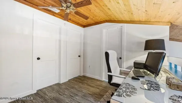 a workspace with furniture and a window