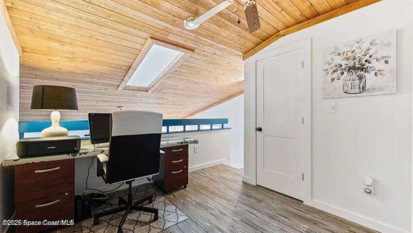 108 Washington Avenue Cape Canaveral, FL 32920 - Photo 18 of 35 a view of a workspace with furniture and a window