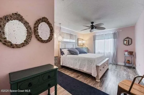 a living room with a bed furniture and a window