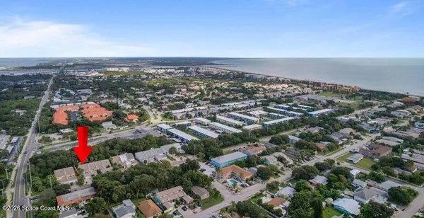 an aerial view of residential houses with city view and lake view