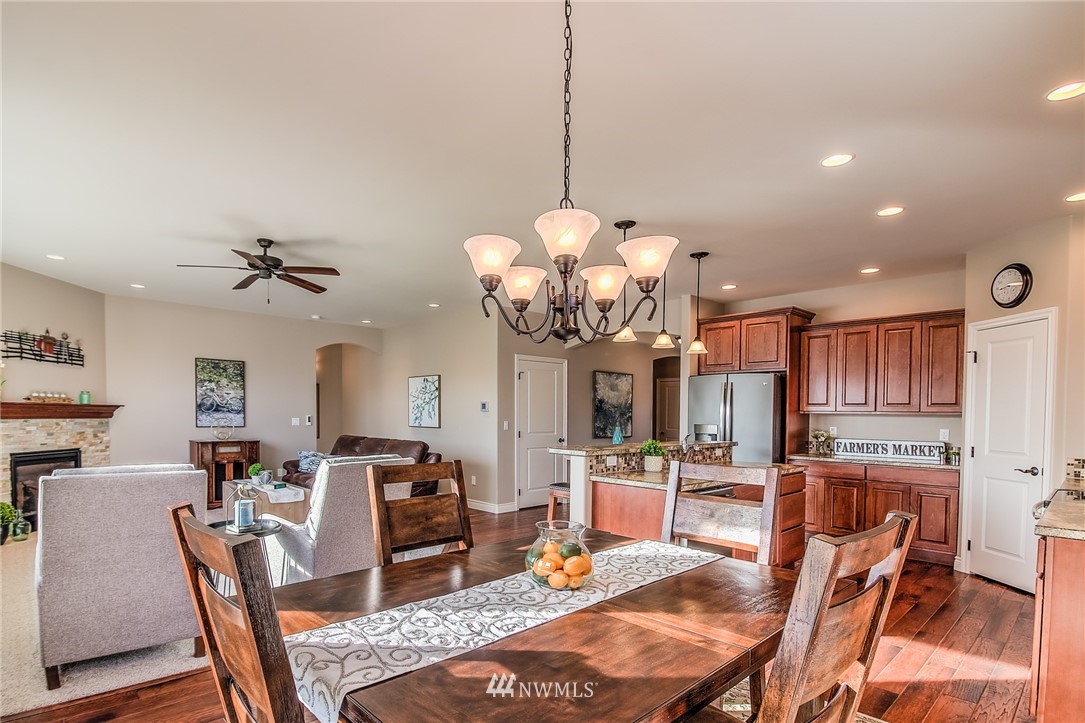 5904 Crestfields Road Yakima, WA 98903 - Photo 17 of 39 a view of a dining room with furniture and wooden floor