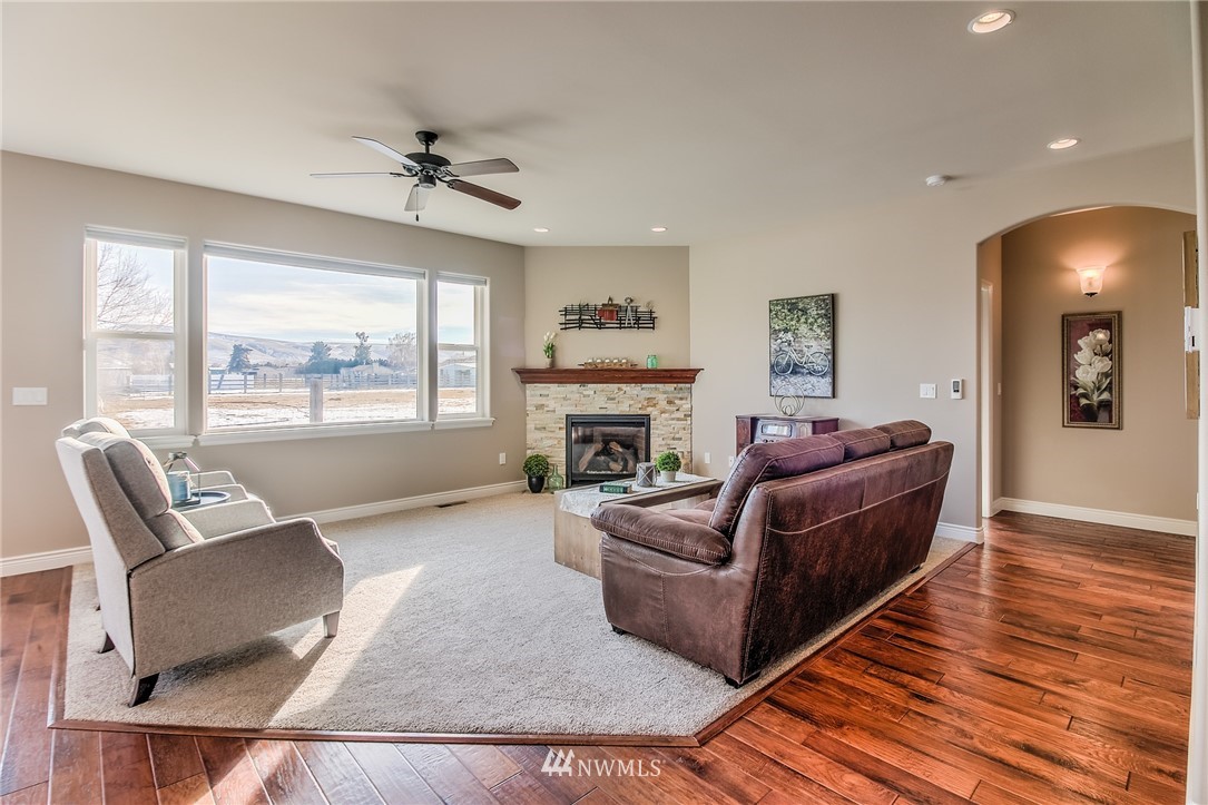 5904 Crestfields Road Yakima, WA 98903 - Photo 18 of 39 a living room with furniture and a fireplace