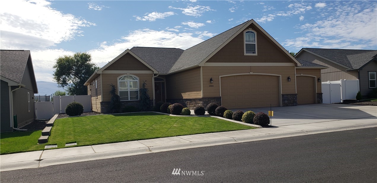 5904 Crestfields Road Yakima, WA 98903 - Photo 2 of 39 a front view of a house with a yard