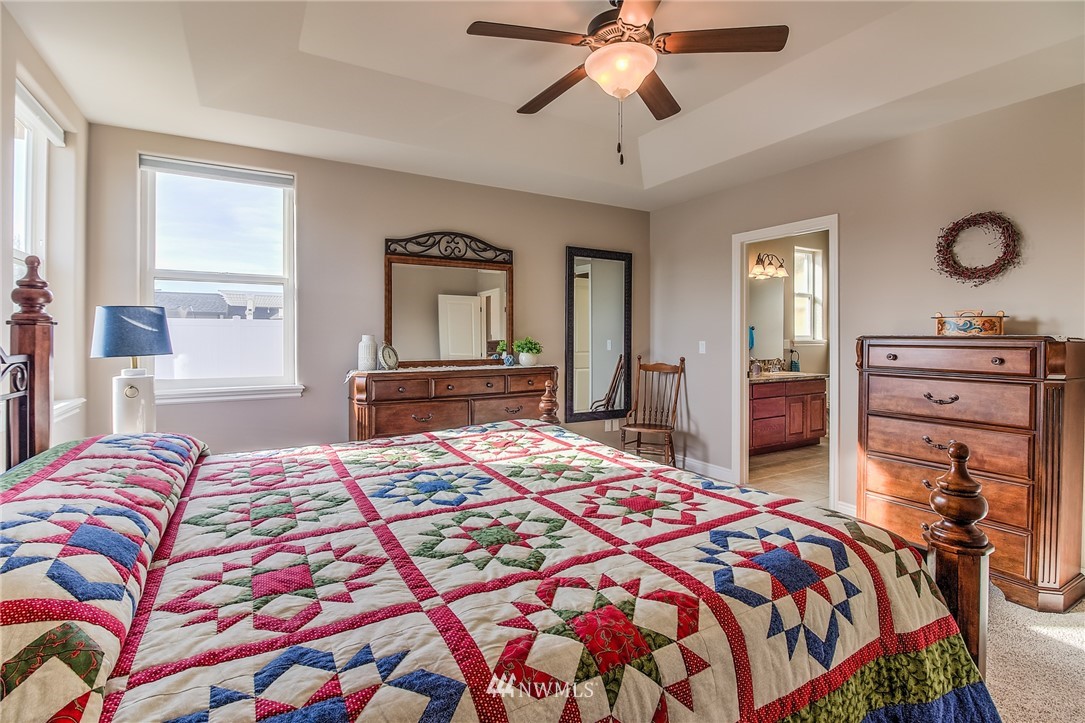 5904 Crestfields Road Yakima, WA 98903 - Photo 22 of 39 a bedroom with a bed and wooden floor