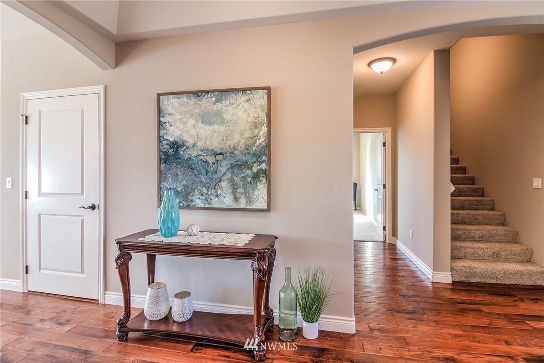 5904 Crestfields Road Yakima, WA 98903 - Photo 28 of 39 a view of a hallway with wooden floor and furniture
