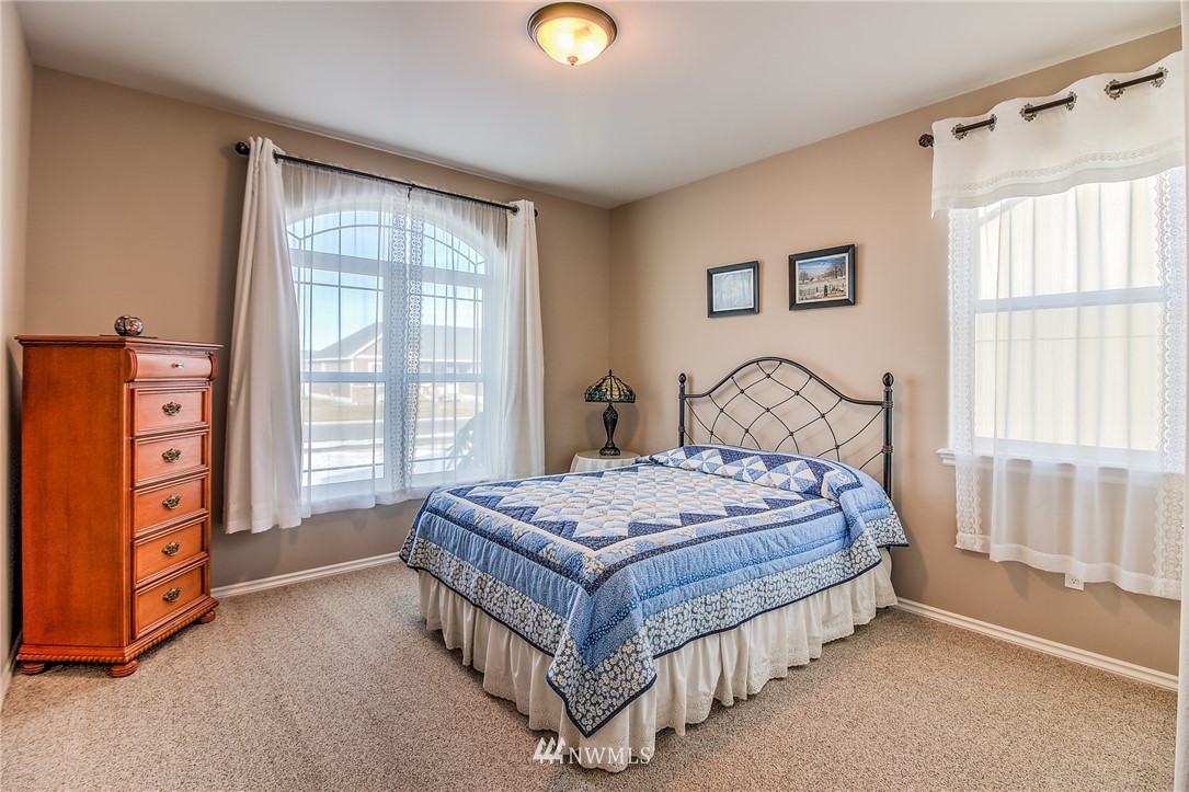 5904 Crestfields Road Yakima, WA 98903 - Photo 33 of 39 a bedroom with a bed and a window