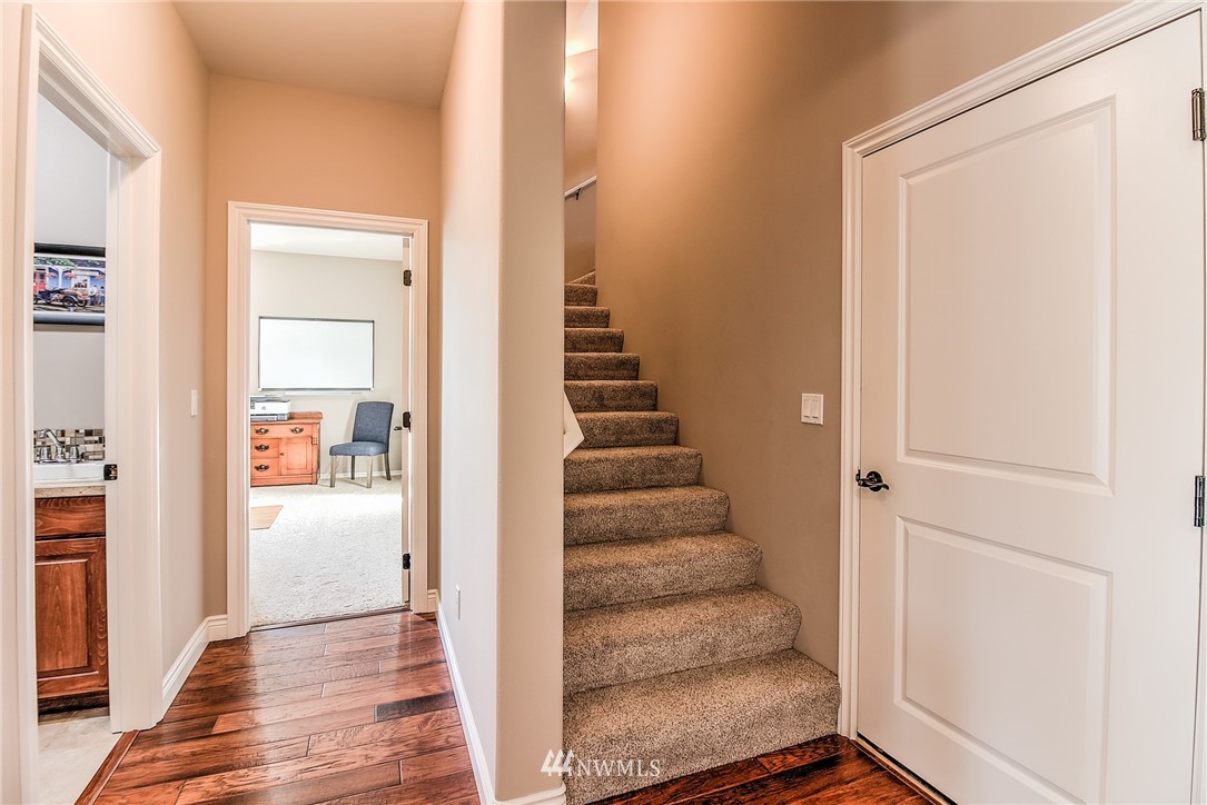 5904 Crestfields Road Yakima, WA 98903 - Photo 34 of 39 a view of a hallway with wooden floor and entryway