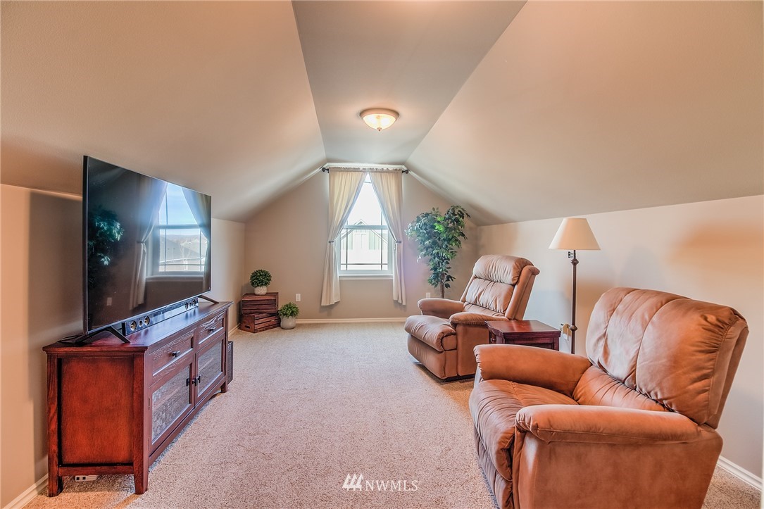 5904 Crestfields Road Yakima, WA 98903 - Photo 35 of 39 a living room with furniture and a flat screen tv