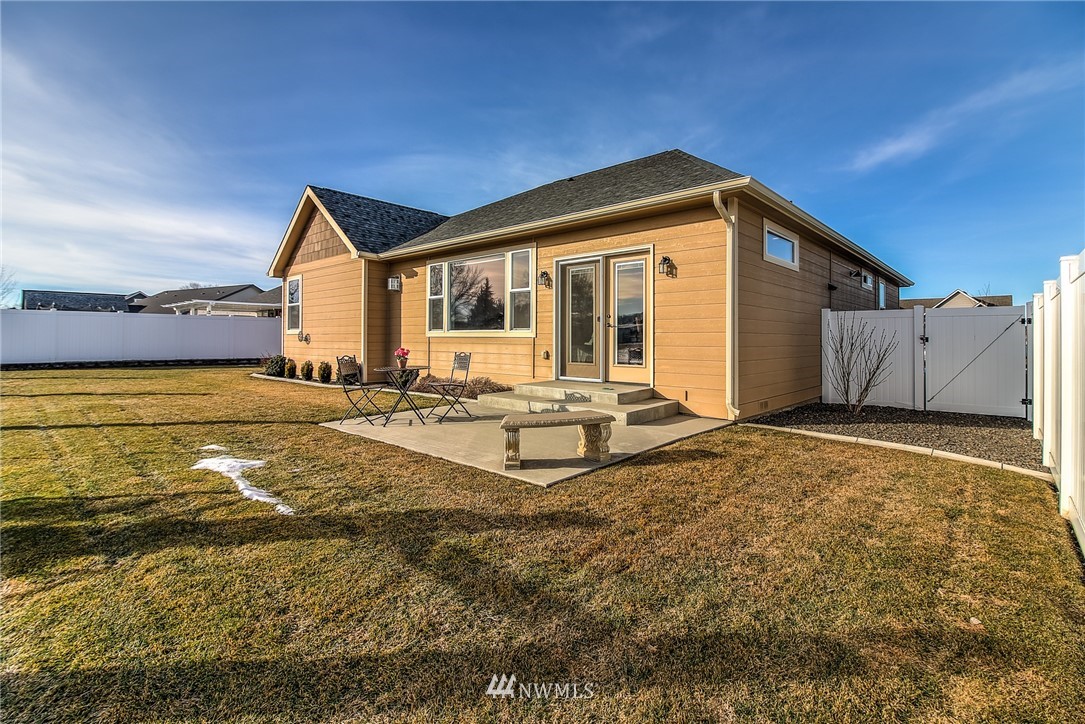 5904 Crestfields Road Yakima, WA 98903 - Photo 4 of 39 a front view of house with yard and trees in the background