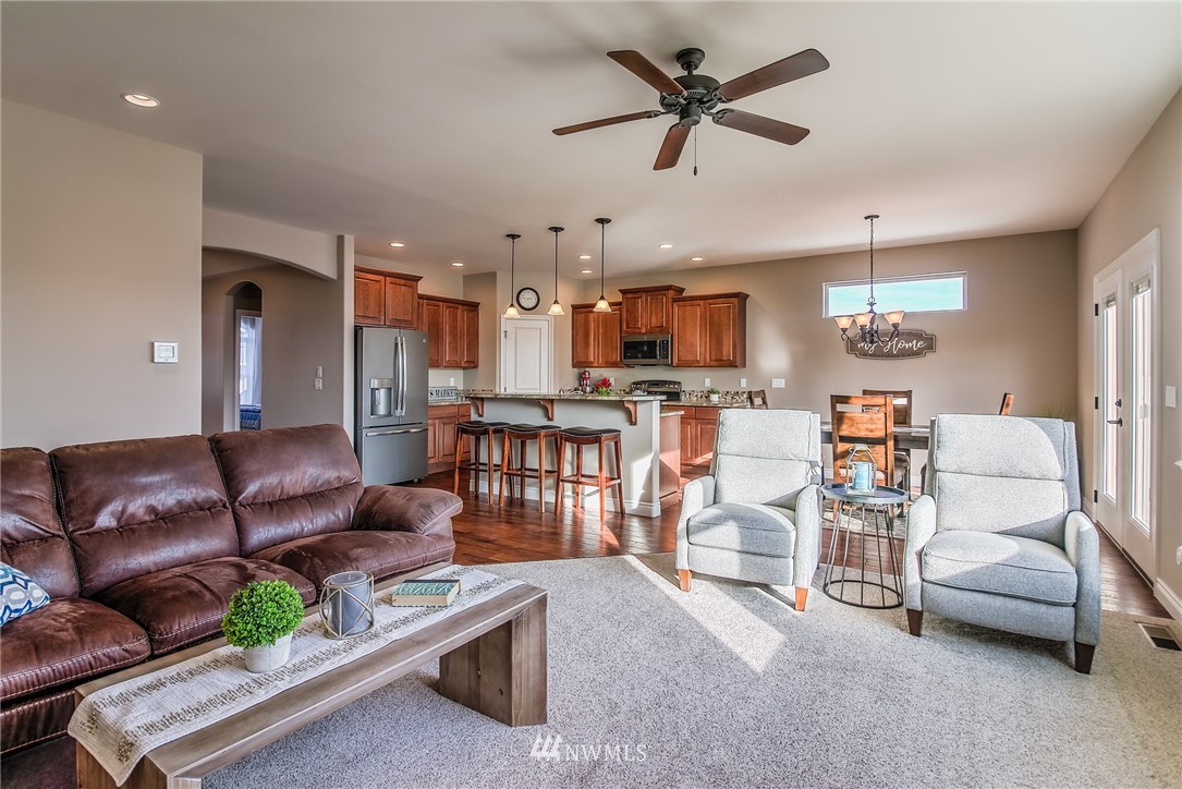 5904 Crestfields Road Yakima, WA 98903 - Photo 10 of 39 a living room with furniture kitchen view and a chandelier