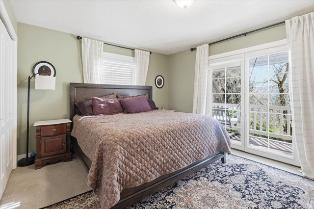 353 Robin Street Smithfield, UT 84335 - Photo 26 of 70 Carpeted bedroom featuring access to outside, a closet, and multiple windows