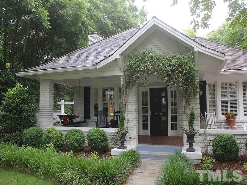 2020 St Marys Street Raleigh, NC 27608 - Photo 1 of 25 a front view of a house with a yard