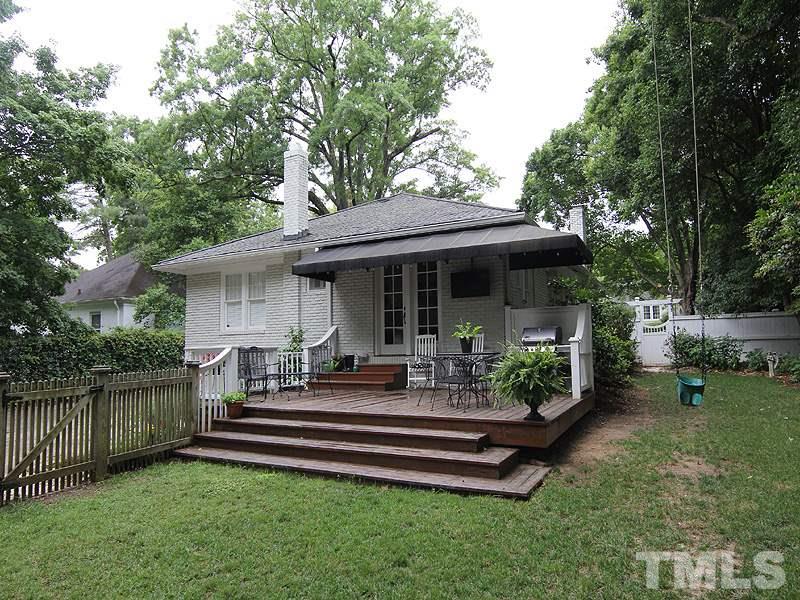 2020 St Marys Street Raleigh, NC 27608 - Photo 22 of 25 a front view of a house with garden and patio