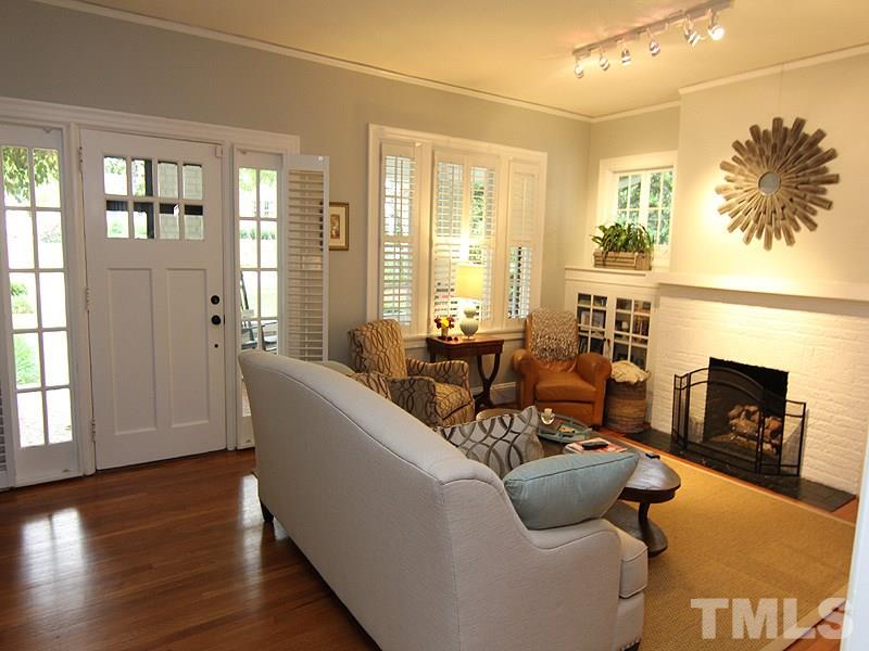 2020 St Marys Street Raleigh, NC 27608 - Photo 6 of 25 a living room with furniture and a fireplace