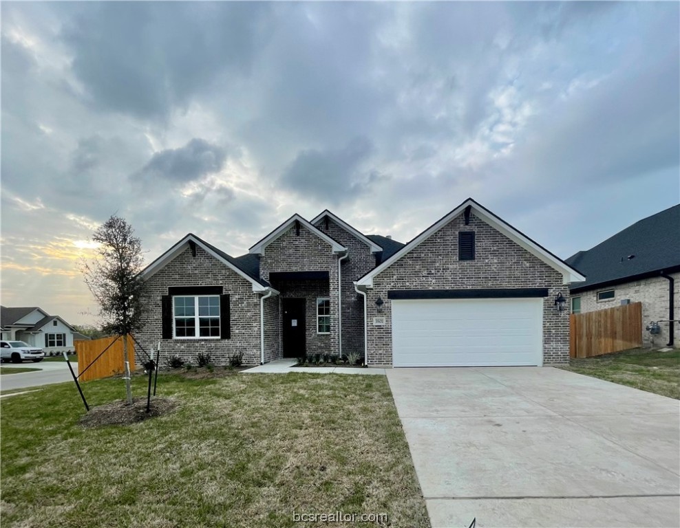 3501 Abingdon Cove Bryan, TX 77808 - Photo 1 of 1 a front view of a house with a yard