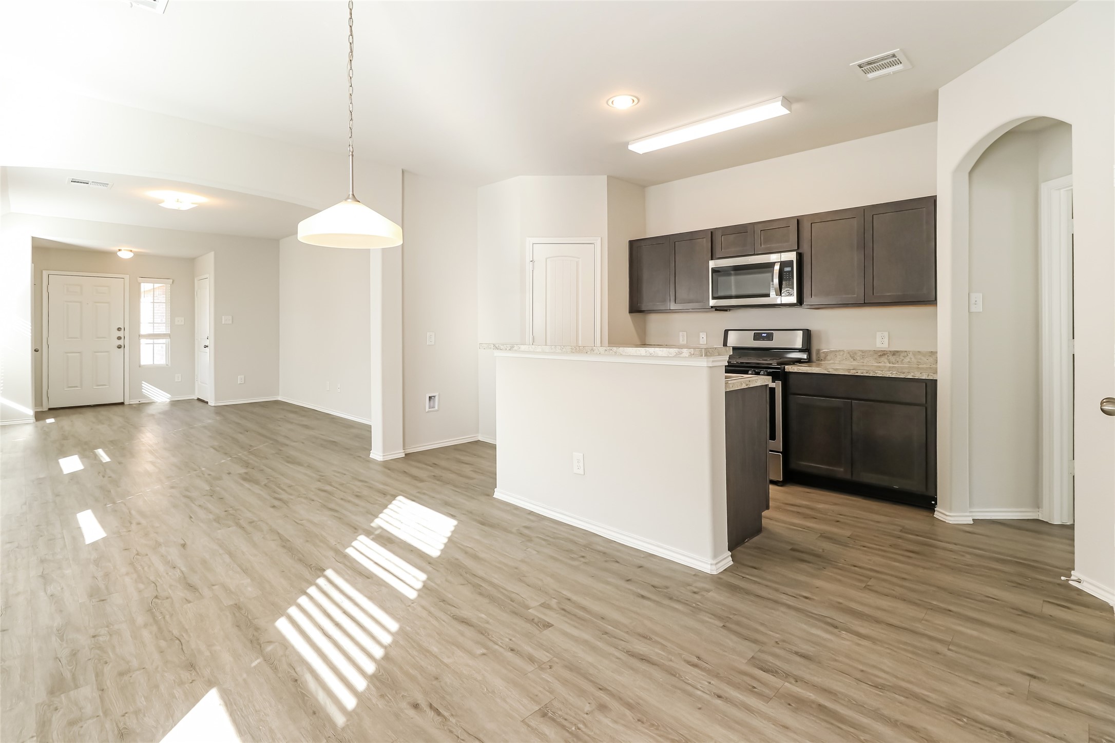 2018 Chunk Court Conroe, TX 77301 - Photo 6 of 16 a kitchen with stainless steel appliances a refrigerator and a stove top oven