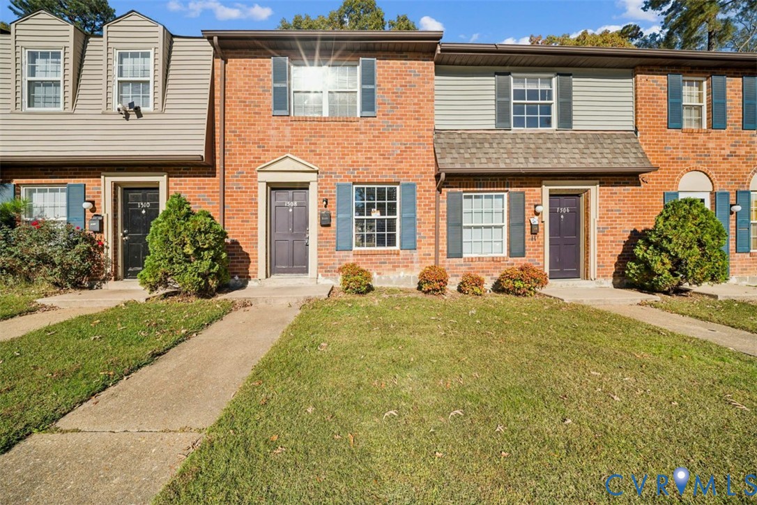 1508 Stowmarket Court Richmond, VA 23225 - Photo 1 of 13 View of front of home with a front lawn and brick