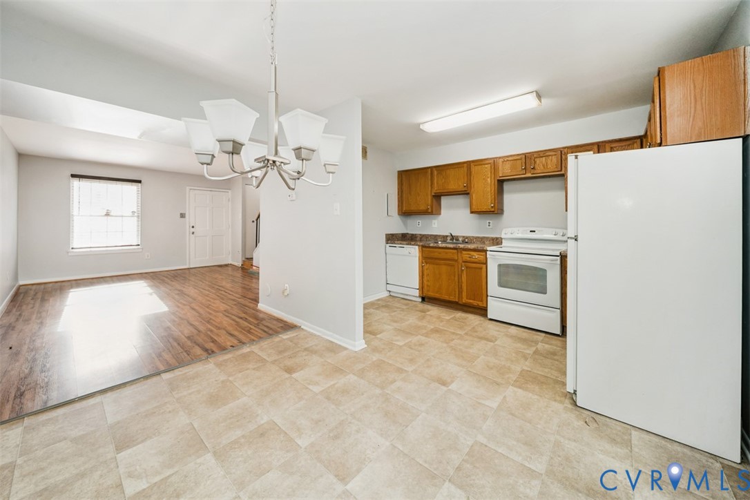 1508 Stowmarket Court Richmond, VA 23225 - Photo 3 of 13 Kitchen with white appliances, a chandelier, decor