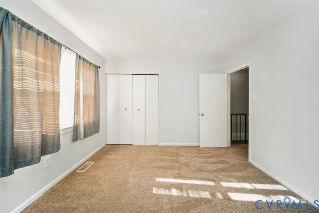 a view of an empty room and window