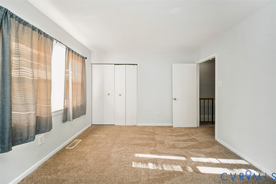 1508 Stowmarket Court Richmond, VA 23225 - Photo 7 of 13 Unfurnished bedroom with carpet and a closet