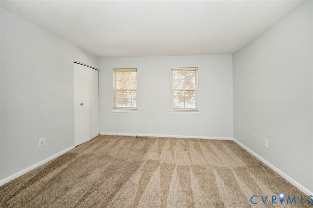 1508 Stowmarket Court Richmond, VA 23225 - Photo 9 of 13 Spare room featuring light colored carpet and base