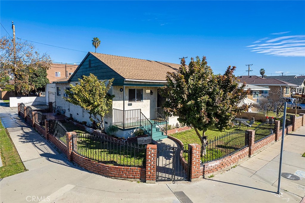 6001 Ferguson Drive Los Angeles, CA 90022 - Photo 1 of 1 a front view of a house with a garden