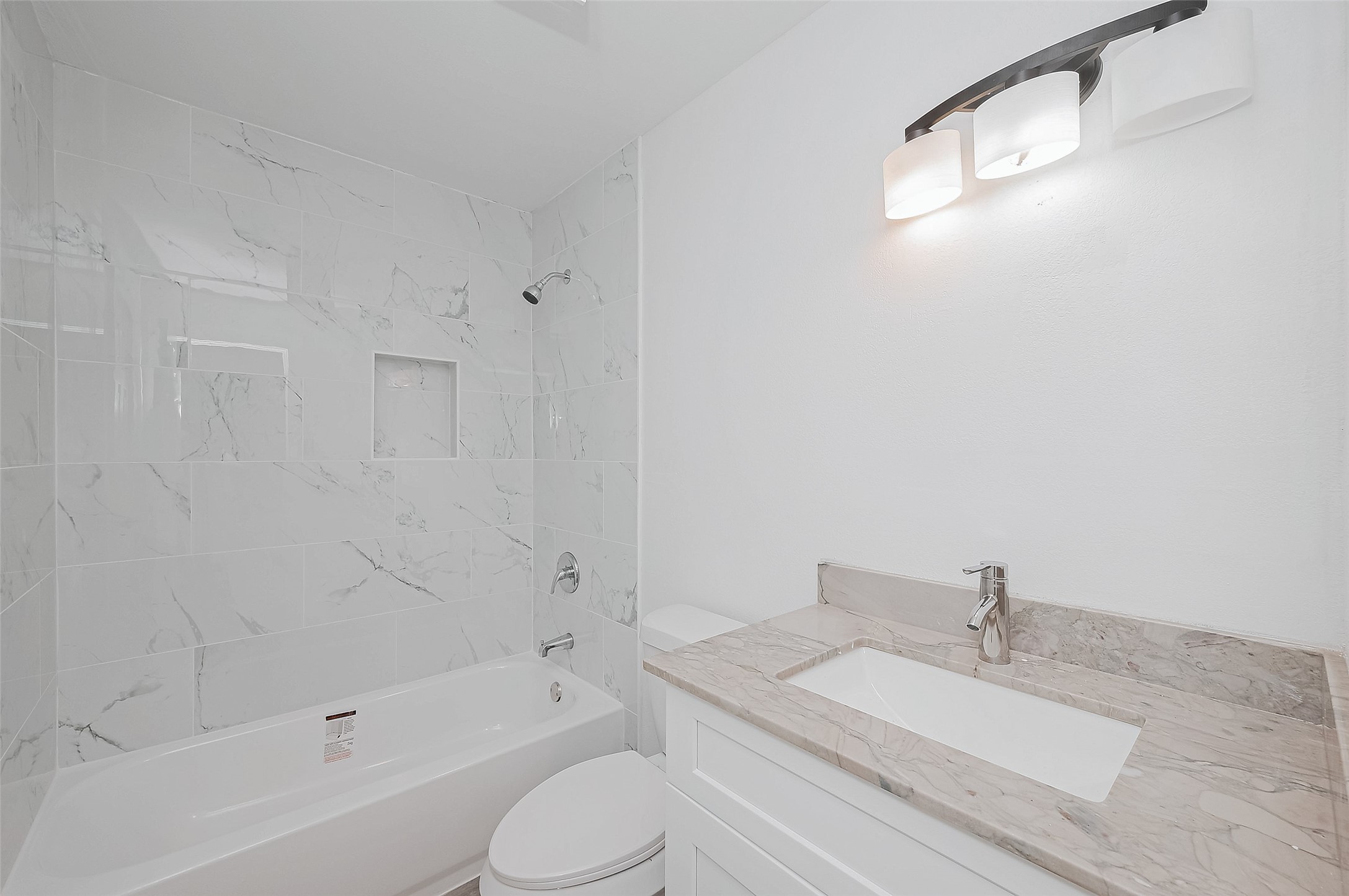 492 Trinity Road Dayton, TX 77535 - Photo 15 of 28 a bathroom with a bathtub a sink a toilet and a shower