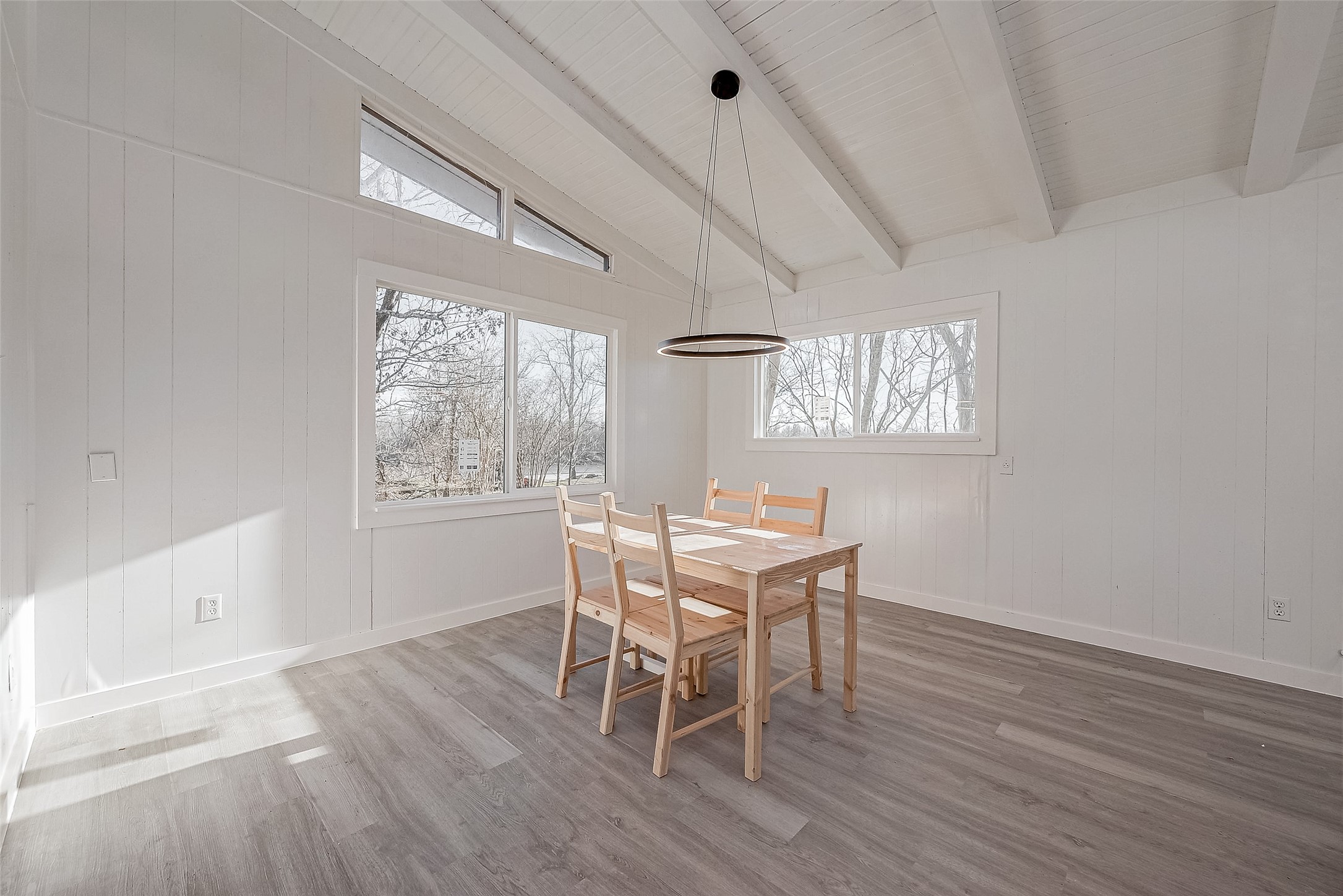 492 Trinity Road Dayton, TX 77535 - Photo 19 of 28 a dining room with wooden floor and a window