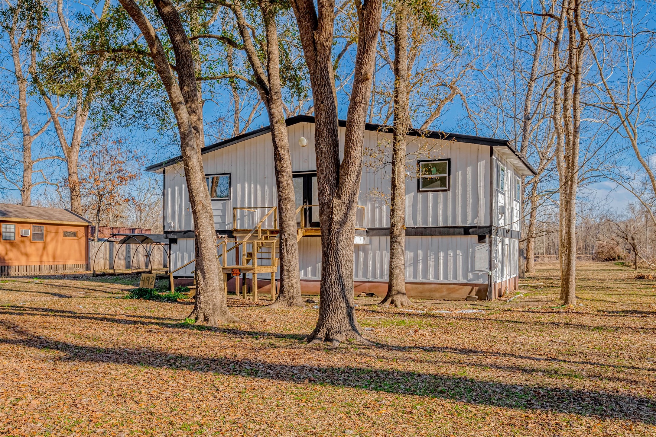 492 Trinity Road Dayton, TX 77535 - Photo 2 of 28 a view of a house with street next to a road
