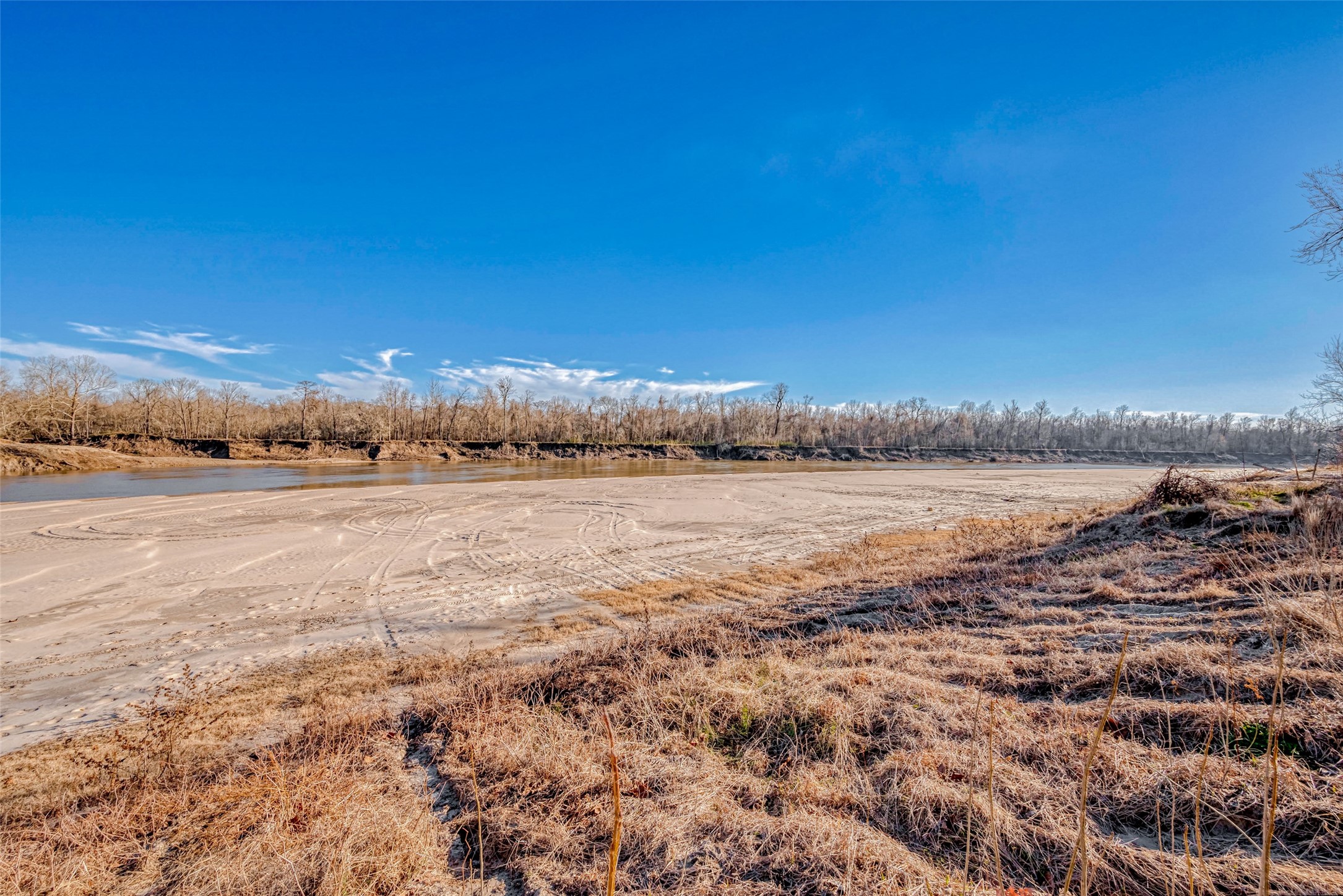 492 Trinity Road Dayton, TX 77535 - Photo 23 of 28 a view of a lake with houses in the back