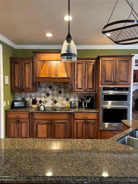 351 Shoals Lane Clarkesville, GA 30523 - Photo 11 of 38 a kitchen with granite countertop a stove sink and cabinets