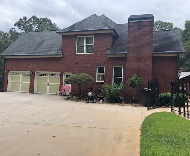 351 Shoals Lane Clarkesville, GA 30523 - Photo 2 of 38 a front view of a house with a yard and garage