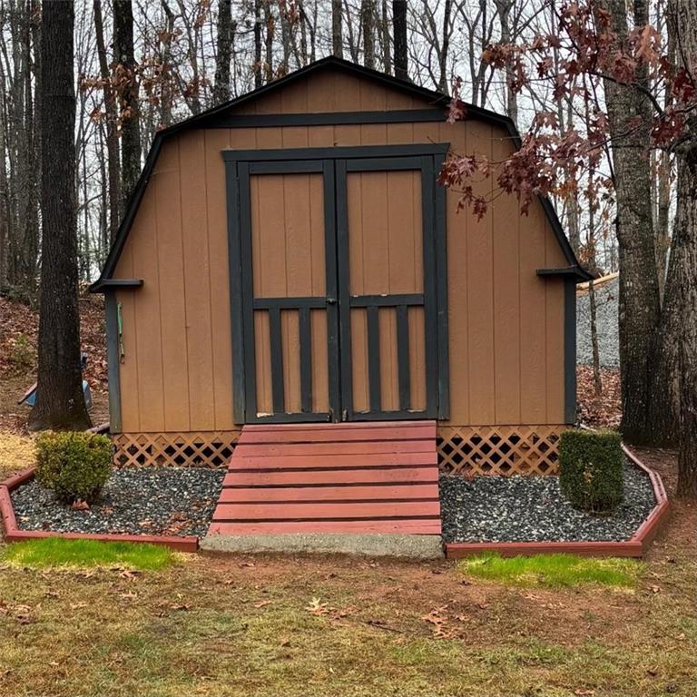 351 Shoals Lane Clarkesville, GA 30523 - Photo 27 of 38 a front view of a house with garden