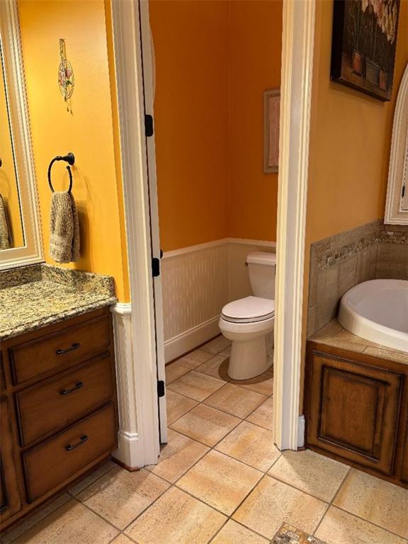 351 Shoals Lane Clarkesville, GA 30523 - Photo 30 of 38 a bathroom with a granite countertop toilet and a sink