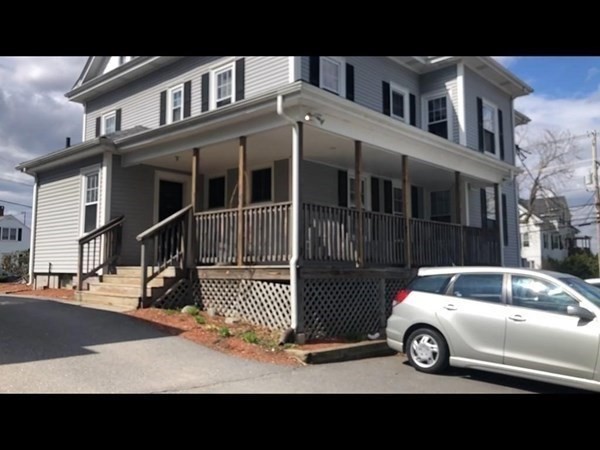 237 Water Street, Unit 2R Clinton, MA 01510 - Photo 9 of 9 a view of a car park in front of house