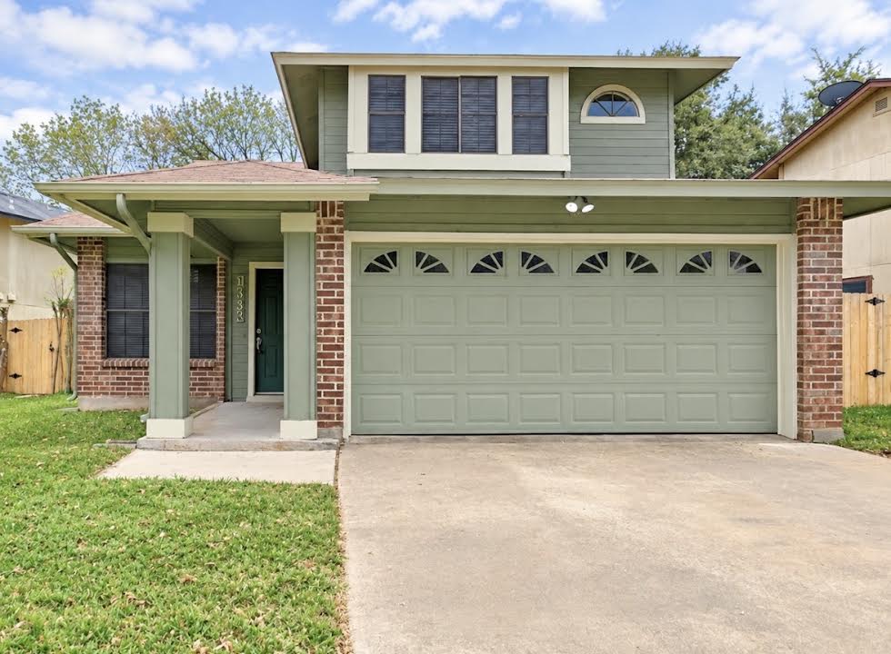 12915 Modena Trail Austin, TX 78729 - Photo 1 of 19 Classic brick and siding detailing frames the welcoming two-story exterior and spacious front-facing garage.