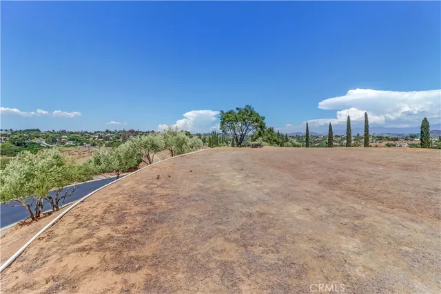 a view of a road with a building in the background