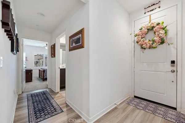 a bathroom with a sink vanity mirror and toilet