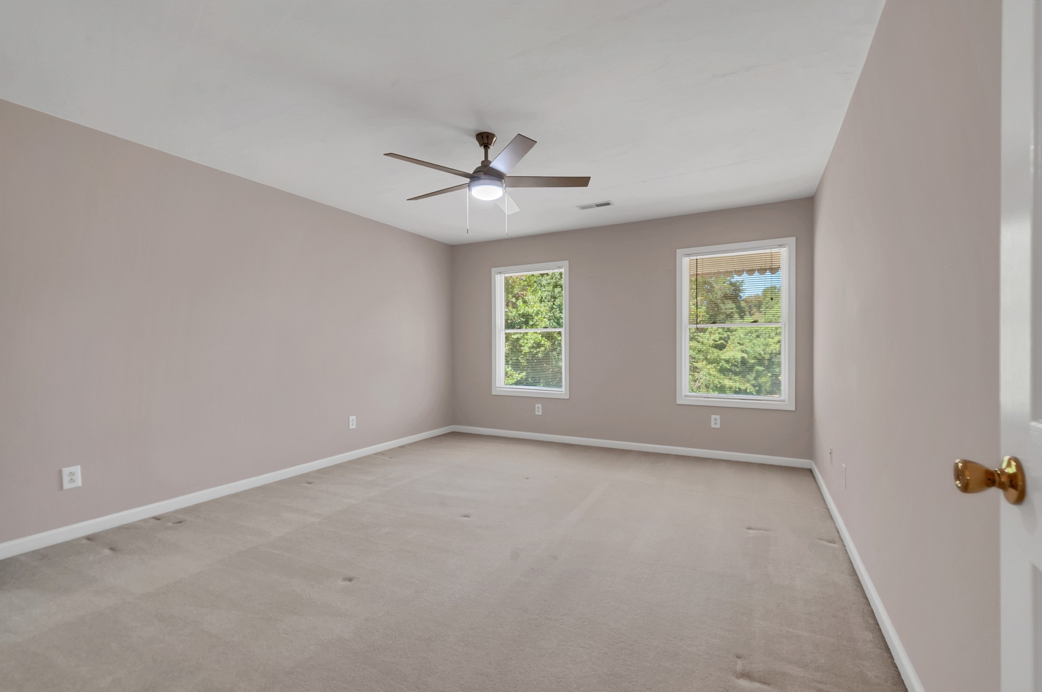 1400 Slaydenwood Road Cumberland Furnace, TN 37051 - Photo 22 of 58 an empty room with windows and ceiling fan