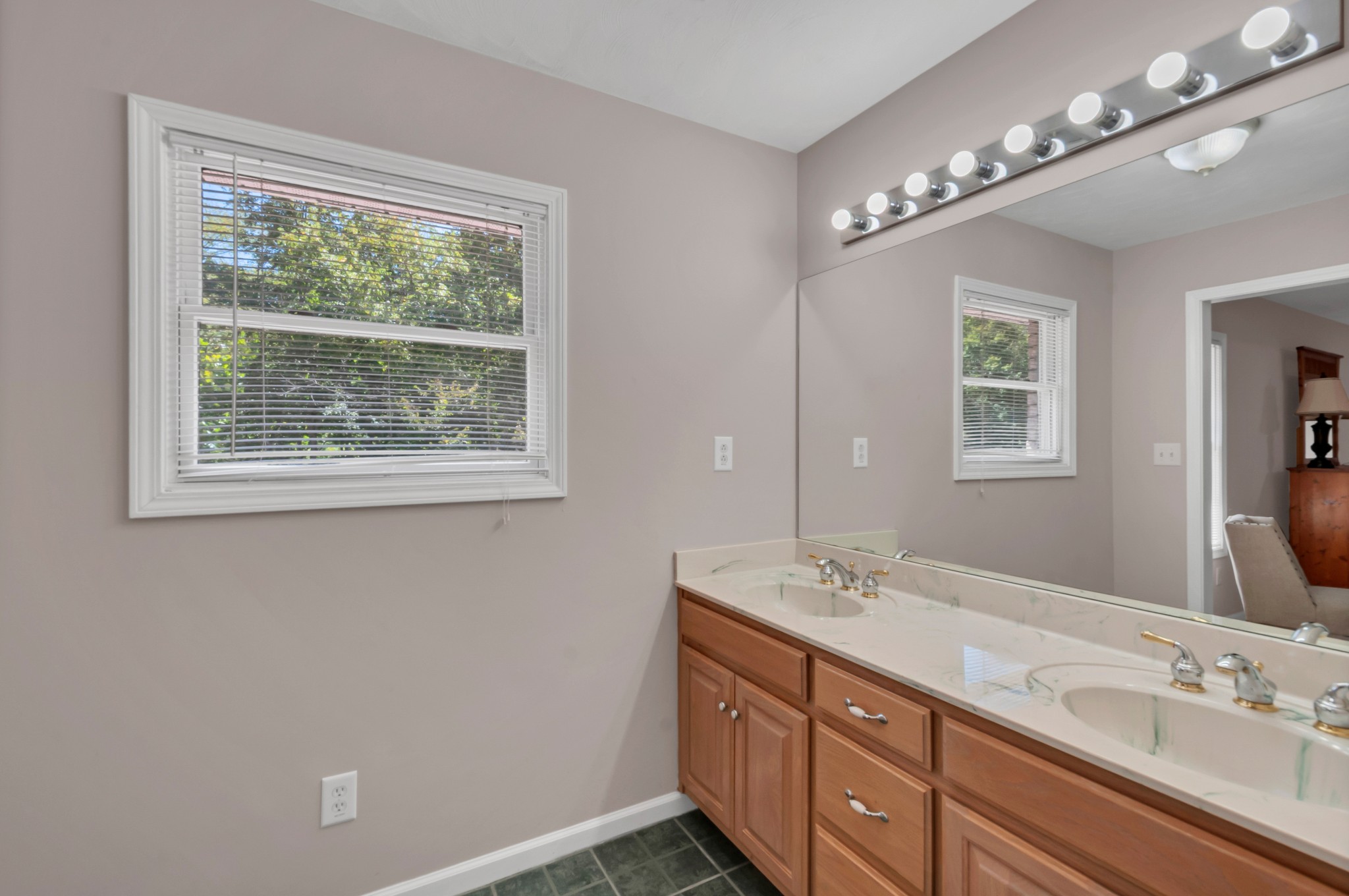 1400 Slaydenwood Road Cumberland Furnace, TN 37051 - Photo 26 of 58 a spacious bathroom with a double vanity sink a large mirror and a window
