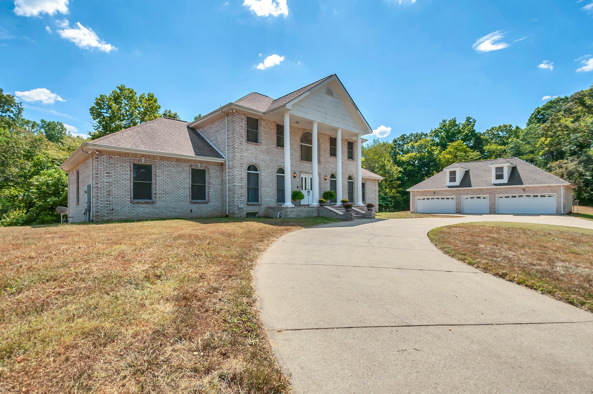 1400 Slaydenwood Road Cumberland Furnace, TN 37051 - Photo 4 of 58 a front view of a house with a garden