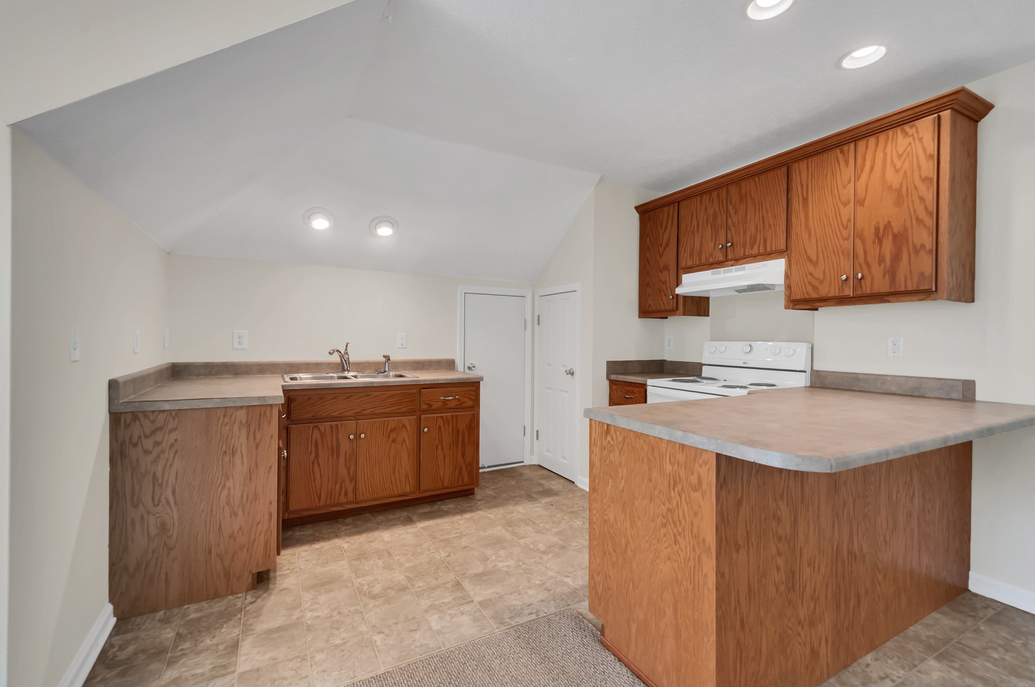 1400 Slaydenwood Road Cumberland Furnace, TN 37051 - Photo 52 of 58 a kitchen with a sink stove and cabinets