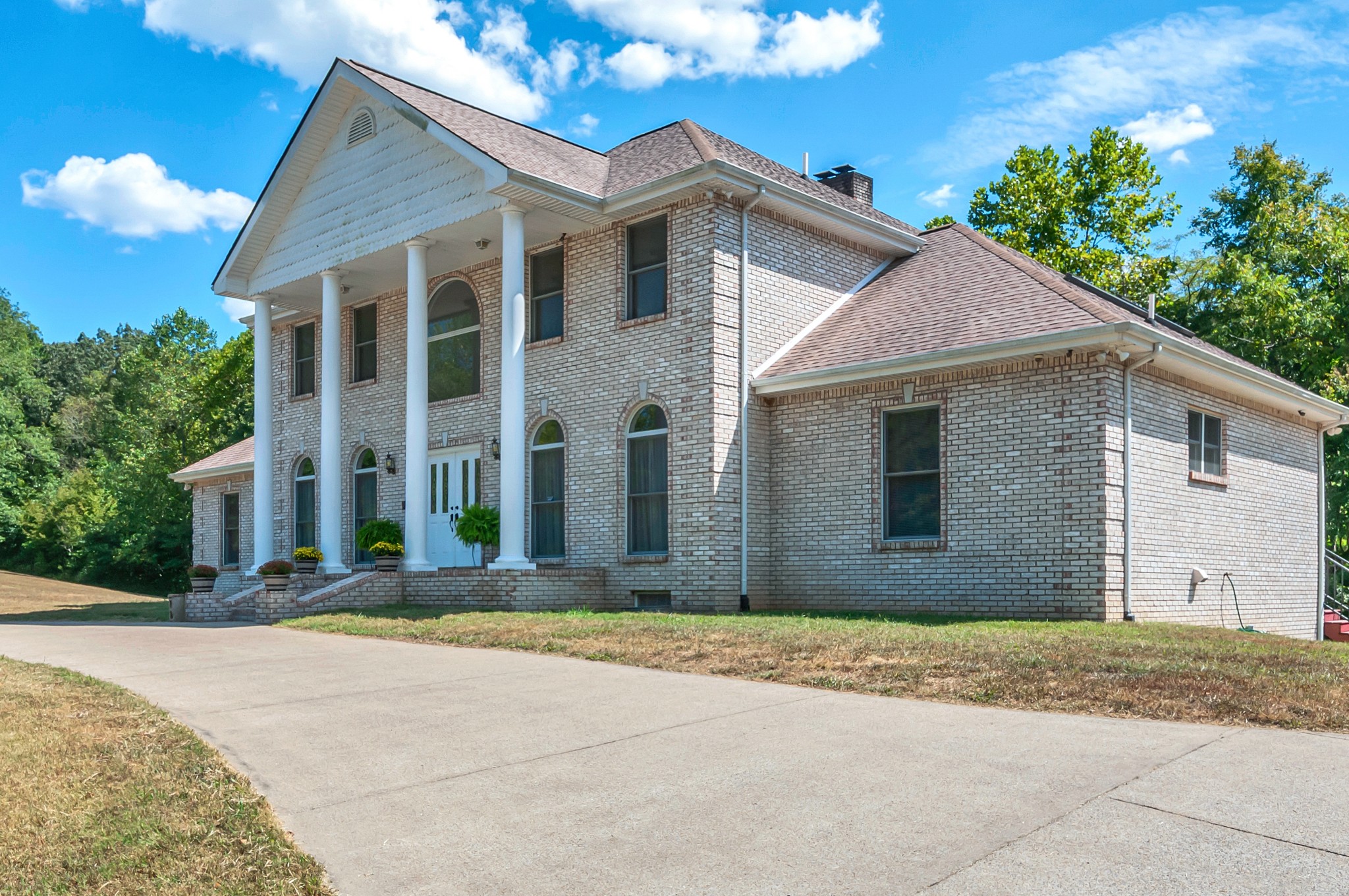 1400 Slaydenwood Road Cumberland Furnace, TN 37051 - Photo 56 of 58 a front view of a house with a yard and garage