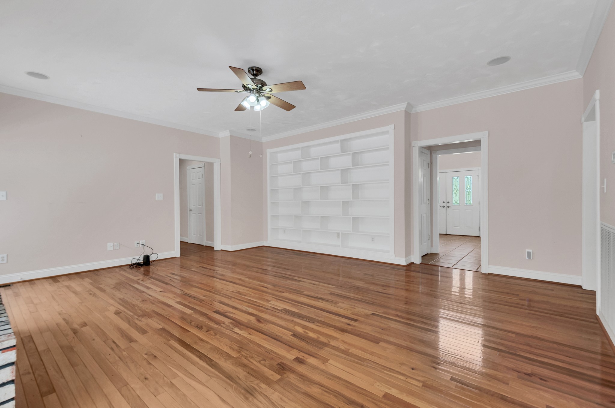 1400 Slaydenwood Road Cumberland Furnace, TN 37051 - Photo 8 of 58 a view of an empty room with wooden floor and a ceiling fan