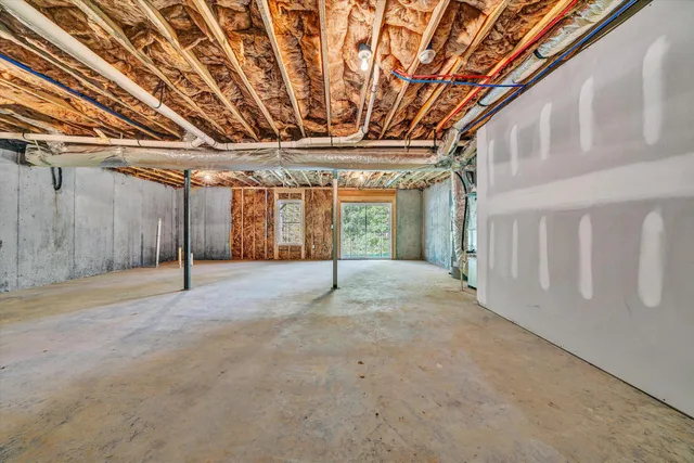 a view of a room with wooden walls