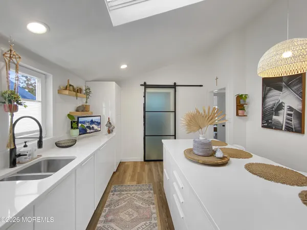 a bathroom with a shower a mirror and a shower