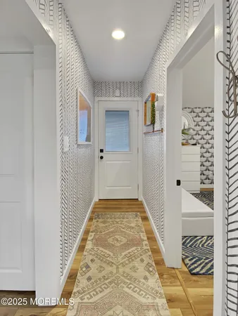 a bedroom with a bed and a mirror on dresser