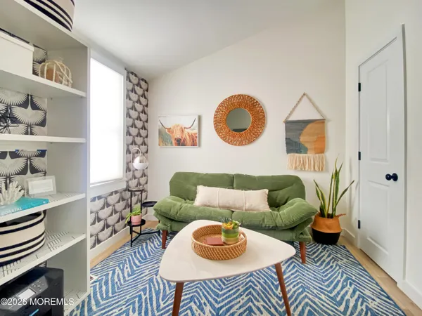 a bedroom with a bed and a couch