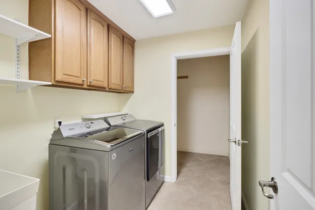 a utility room with granite countertop a sink